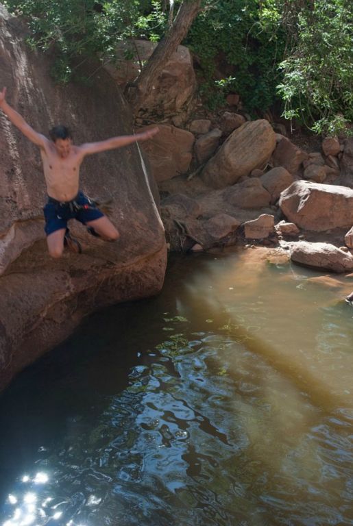Jon Jasper jumping into pool at the end of Pine Creek.    Photo by Janel Macy.