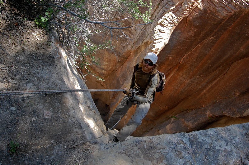Tim Barnhart starting the 300-ft rappel into Englestead Canyon.  Photo by Janel Macy.
