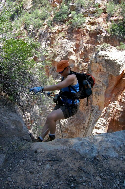 Megan Porter starting the 300-ft rappel into Englestead Canyon.  Photo by Janel Macy.